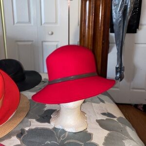 Red wool hat with black tie